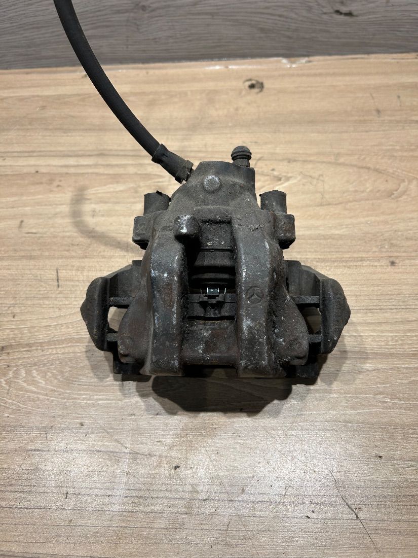 Суппорт задний левый